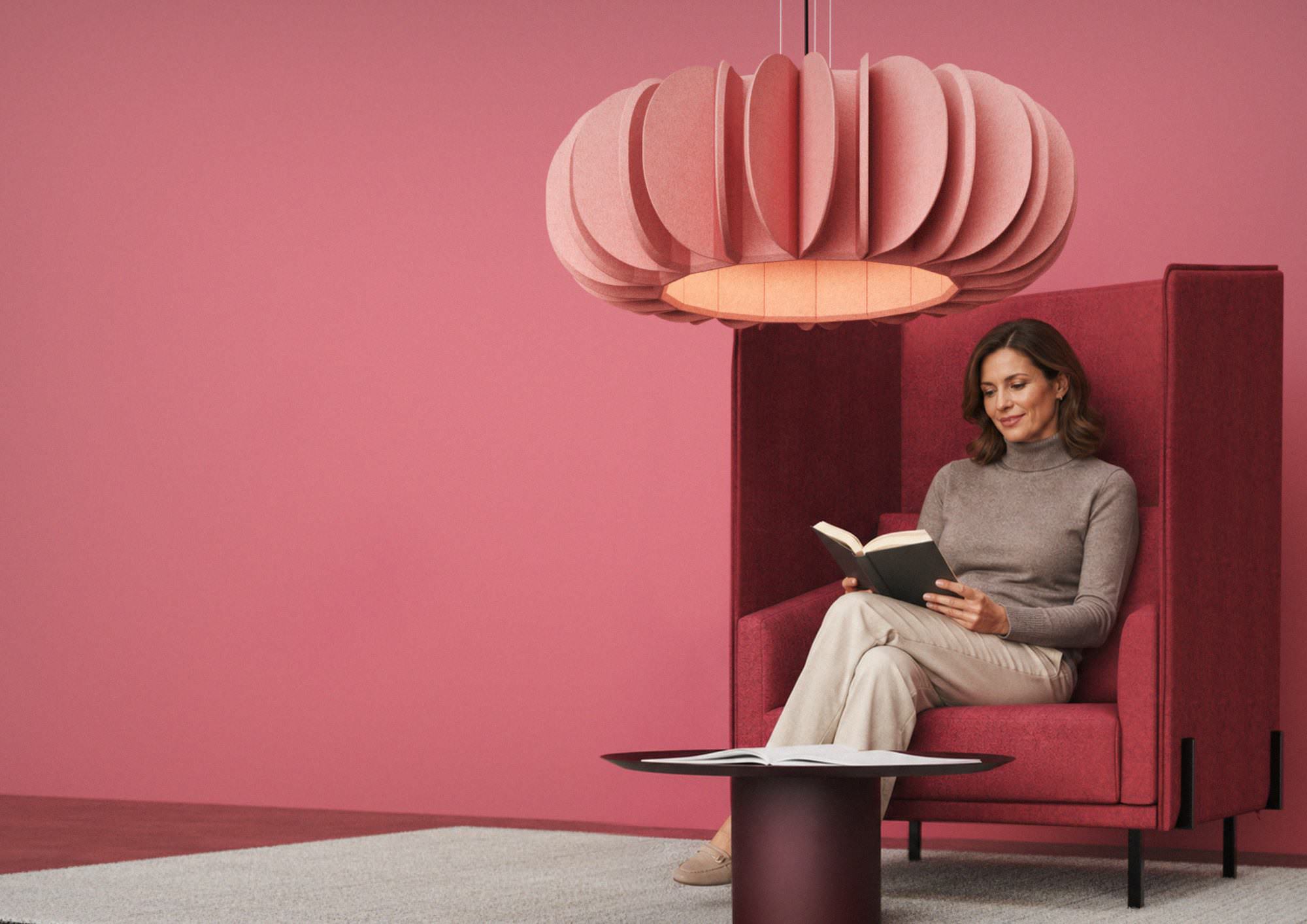 Older woman relaxing beneath acoustic lighting.